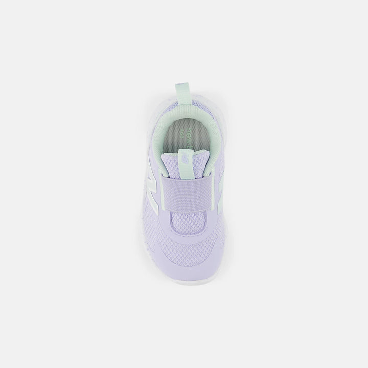 Purple sneaker with green sole on a white background