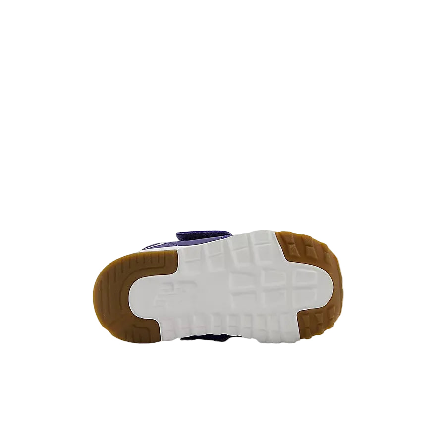 Sole of a sneaker with white sole, brown heel, and purple side on a white background
