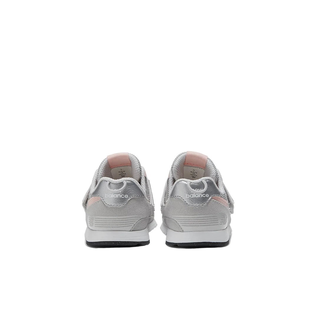 Pair of gray sneakers with 'New Balance' branding on a white background