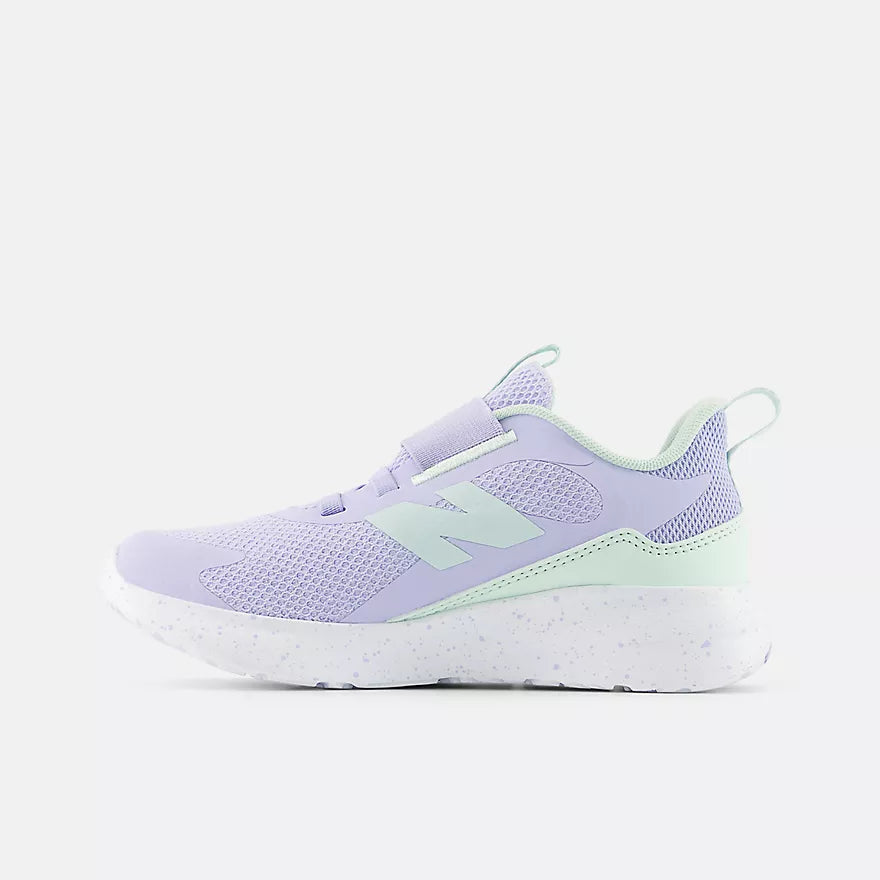 Lavender sneaker with a white sole on a light gray background