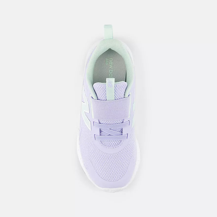 Light purple sneaker with green accents on a white background