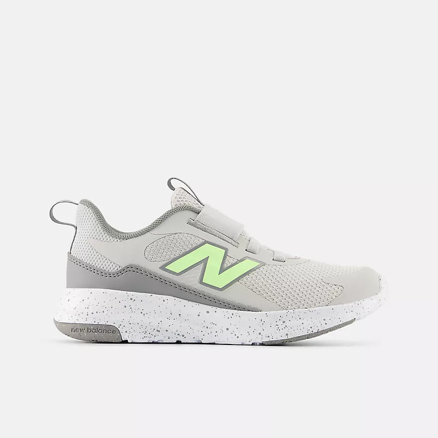 Gray sneaker with green accents on a white background