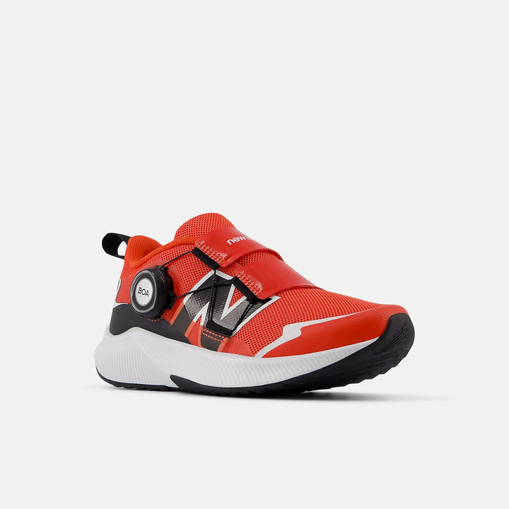 A pair of New Balance DynaSoft Reveal v4 BOA sneakers for little kids and big kids, featuring a red and black color scheme with white accents and the BOA logo.