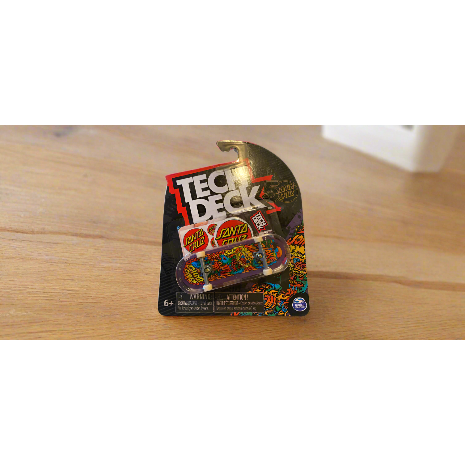 Tech Deck skateboard deck packaging with branding on a white background