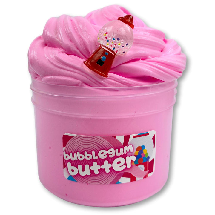 A container of Dope Slimes Bubblegum Butter Slime, showing a thick, pink clay dough texture with a small bubblegum butter container on top, and the product's name on the label.