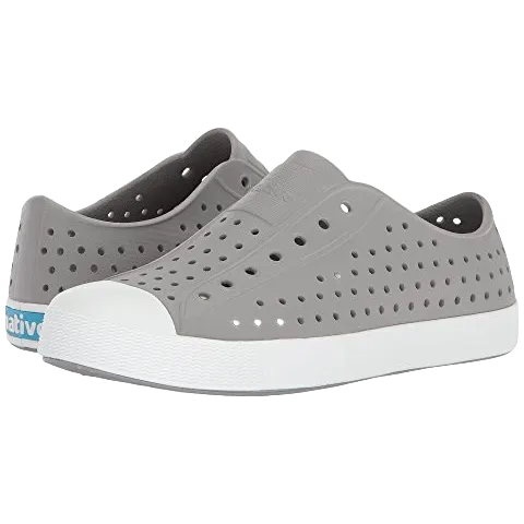 Toddler-sized Native Jefferson slip-on shoes in gray color with a white sole, featuring perforations for breathability and an EVA upper material.