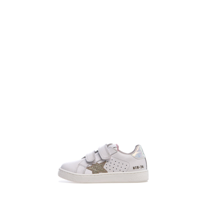 A white Naturino Pinn VL sneaker for toddlers with a glittered patch on the side and double Velcro straps.