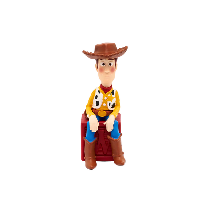 A figurine of the character Woody from Toy Story, dressed in his iconic cowboy outfit with a hat, sitting on a chair.