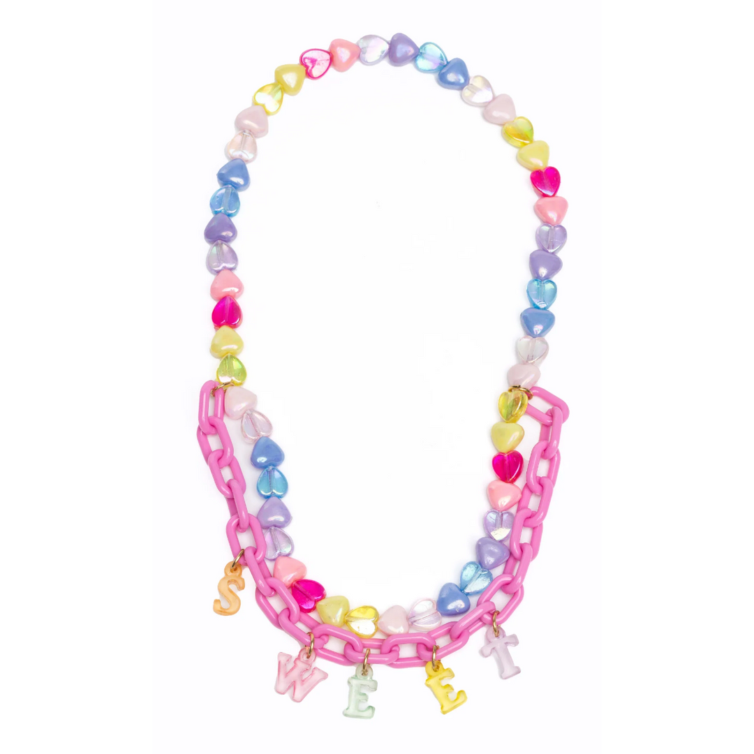 A colorful necklace with heart-shaped beads and a pink chain link, featuring charms with the text 'SWEET'.