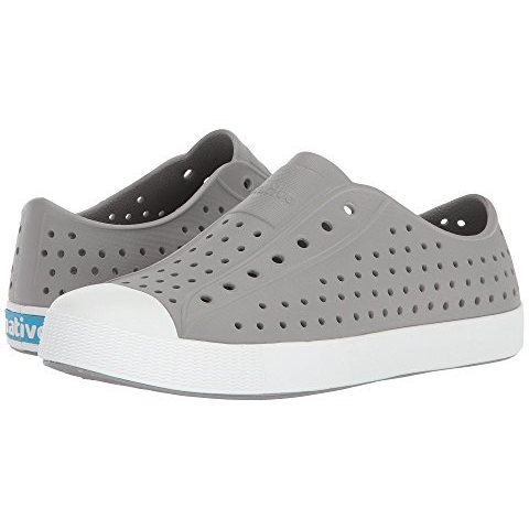 Toddler-sized Native Jefferson slip-on shoes in gray color with a white sole, featuring perforations for breathability and an EVA upper material.